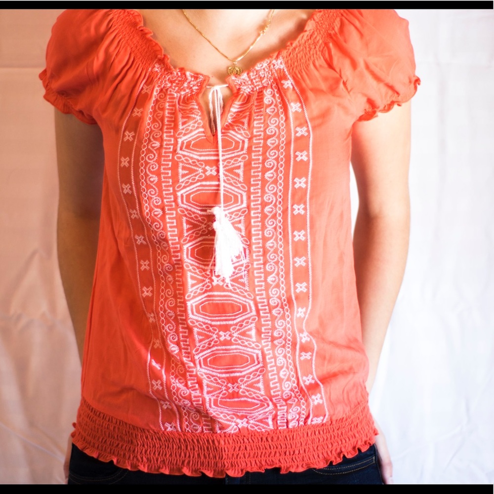 Bright orange top